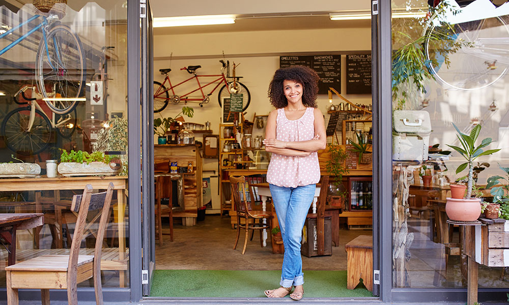 Woman standing in doorway of bike shop